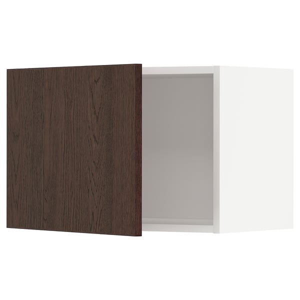 Dark brown wooden cabinet door and white cabinet box.