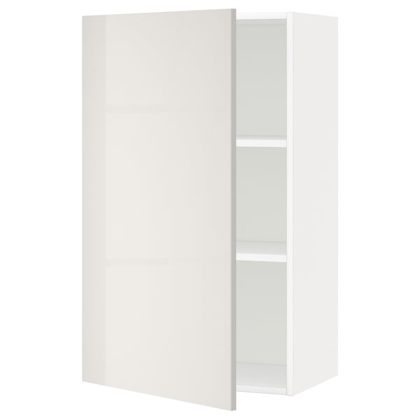 A white wall cabinet from the ikea METOD kitchen system, showcasing a modern design with high gloss doors and adjustable shelves.