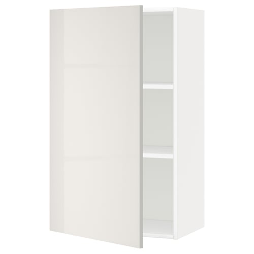 A white wall cabinet from the ikea METOD kitchen system, showcasing a modern design with high gloss doors and adjustable shelves.