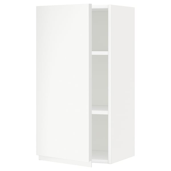 A white METOD kitchen cabinet with a simple, modern design and adjustable shelves. It a door with integrated handles and a sturdy frame.