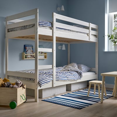 White MYDAL bunk bed with blue bedding in cosy blue room.