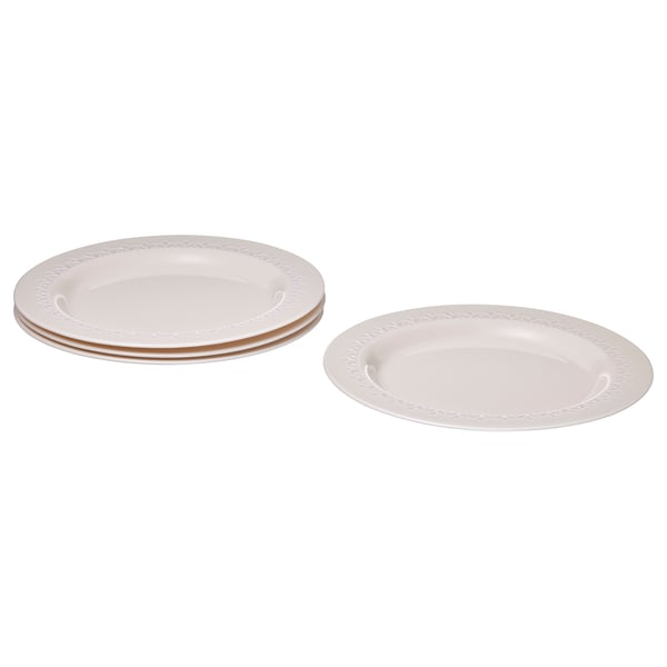 Stack of four white, round, tempered glass plates with a beaded rim design, suitable for dining.