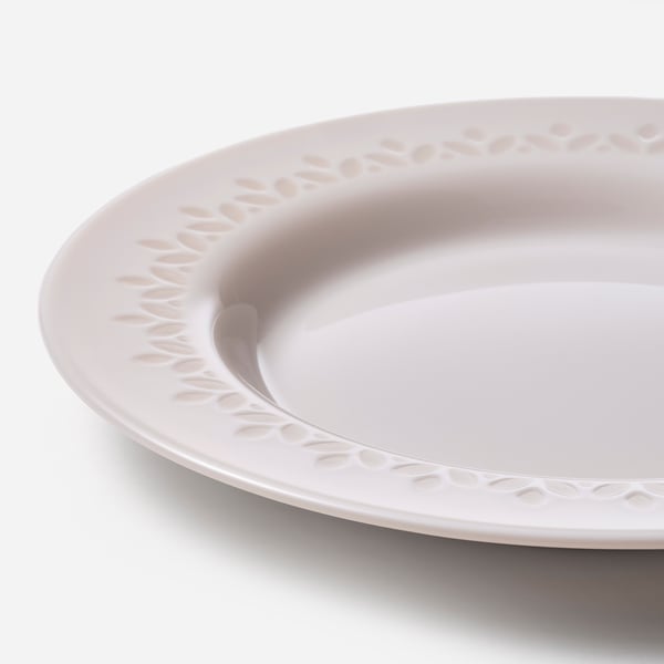 White dinner plate with intricate, textured rim; appears sturdy, stylish.