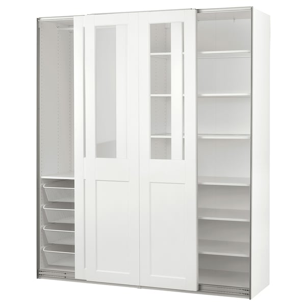 A white PAX wardrobe with glass doors and metal mesh baskets. It sliding doors and shelves for storage.
