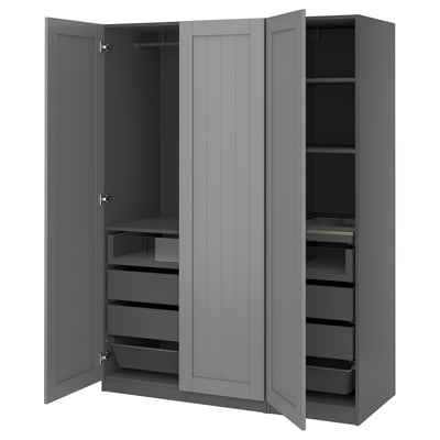 An open grey PAX wardrobe with drawers and shelves.