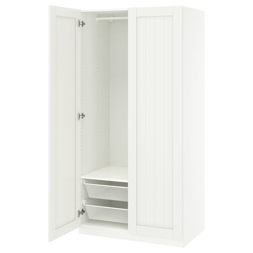 White PAX wardrobe, open door revealing shelves and basket inside.