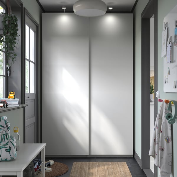 Minimalist white dresser, recessed lights, storage.