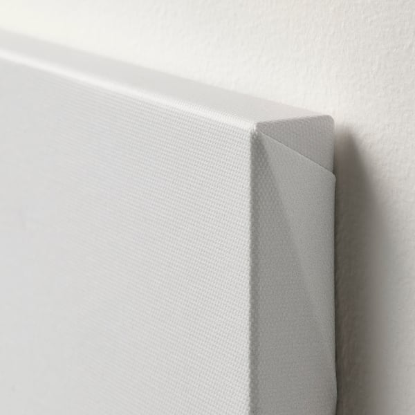 Close-up of high-quality canvas edge: smooth texture, clean fold, deep frame.