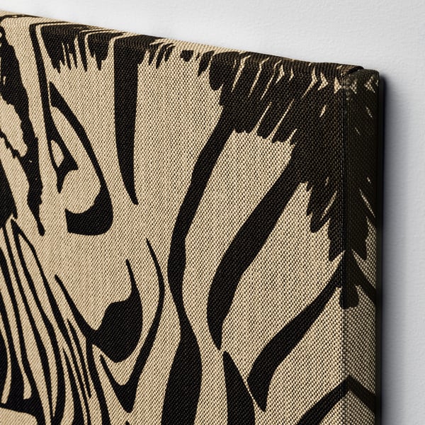 Canvas wall art with black abstract pattern on beige background, wrapped around frame. Detailed, high-quality print.