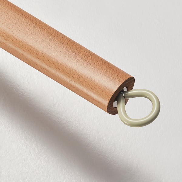 Close-up of sturdy wooden handle with gold metal ring, showcasing quality craftsmanship.