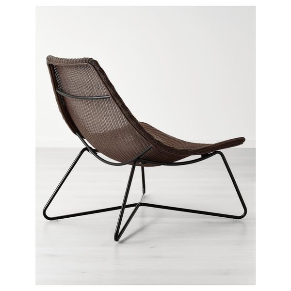 Contemporary chair with woven rattan seat, sturdy metal frame, elegant design.