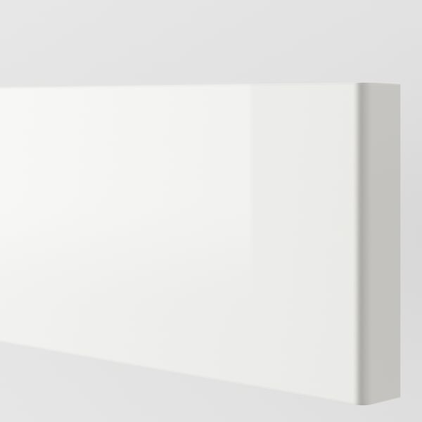 Sleek white glossy kitchen cabinet. Modern design, smooth touch, clean lines.