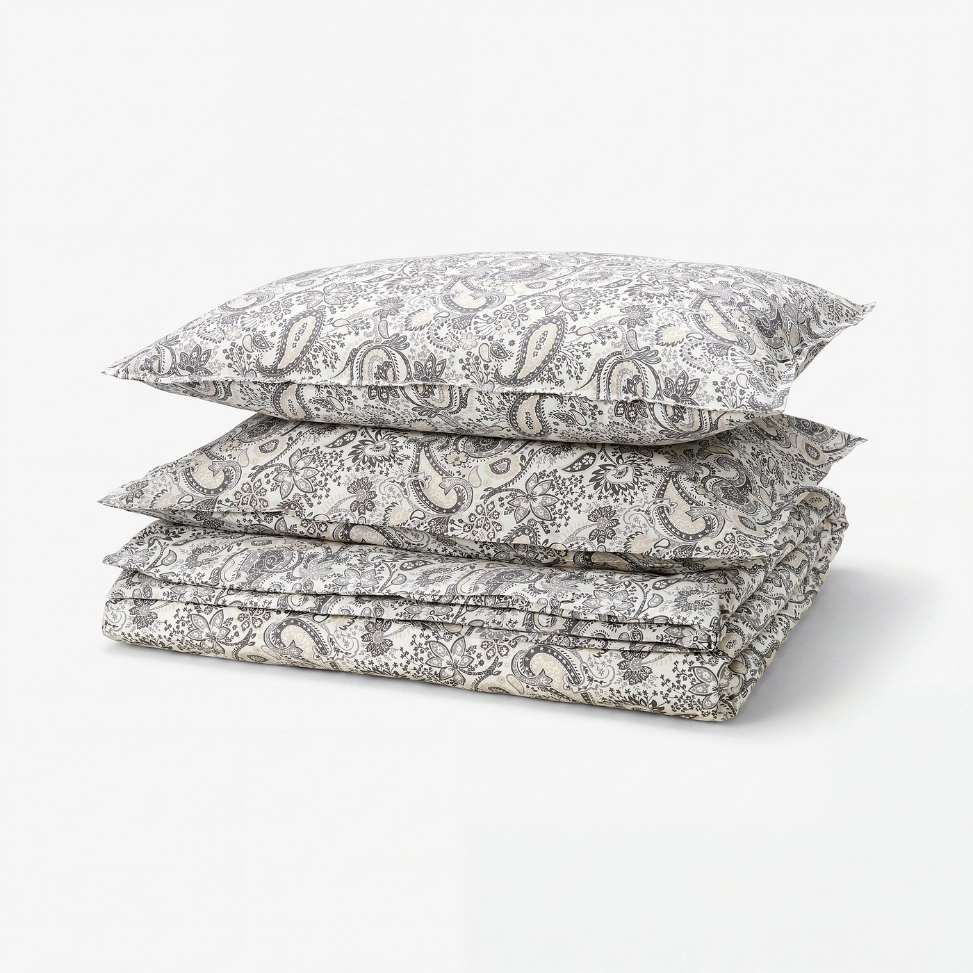 Paisley-patterned bedding set in cream/white, featuring soft cotton-viscose blend, neatly folded.