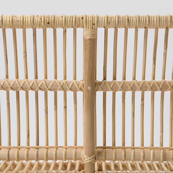 Intricate rattan bench, handwoven with sturdy vertical slats and diamond-patterned crossbar, showcasing quality craftsmanship.