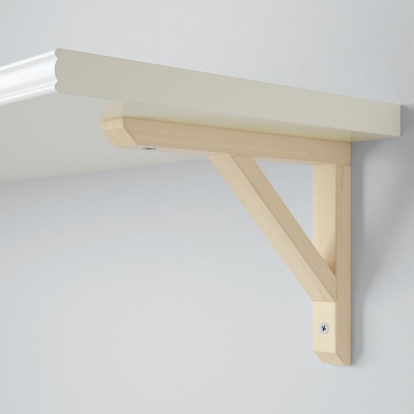 Wooden shelf bracket on wall, supporting light shelf, natural finish, sturdy design.