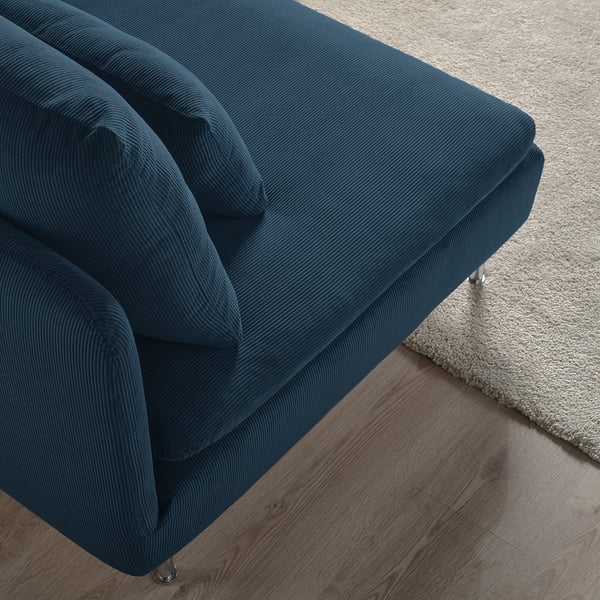 Deep-seated, modern sofa sectional in rich blue corduroy, offering comfort and style.