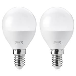 Two ikea led light bulbs, white, spherical shape, e14 base, stand upright, brand visible.