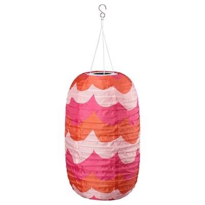 SOLVINDEN solar lantern, colourful waves, hangs by string, emits soft light.