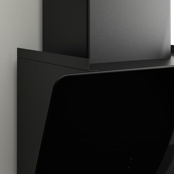 Black modern kitchen hood with clean lines and glass surface.