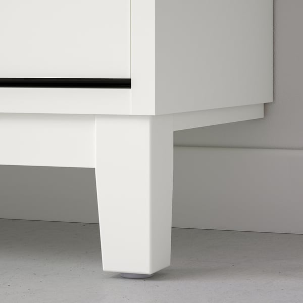 A sleek white cabinet with sturdy support, showcasing high-quality design and durable materials.