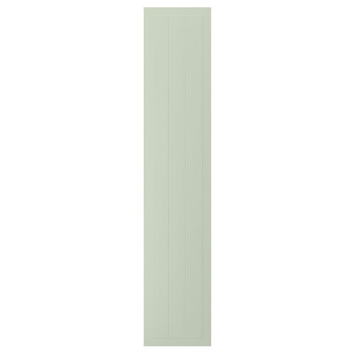 A rectangular, green STENSUND cabinet door. It vertical grooved panels and a smooth, lacquered finish, giving it a crafted look.