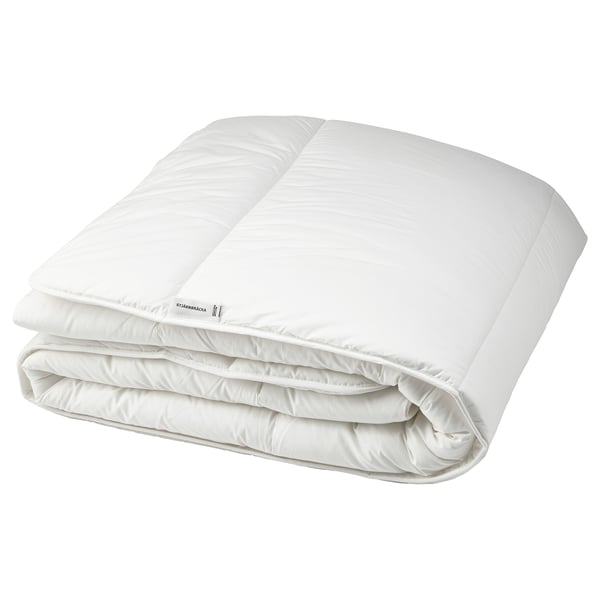 Folded white STJÄRNBRÄCKA duvet with evenly folded edges, seamless design, soft fabric.