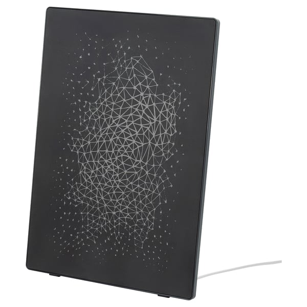 A black SYMFONISK wifi speaker with a white geometric pattern, featuring a sleek, rectangular shape with rounded edges and a modern design.