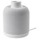 A white ikea SYMFONISK wifi speaker lamp base. Its cylindrical, wrapped in a fabric cover, and designed for use with a lamp shade.