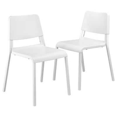 Two white plastic chairs with steel legs, minimalist design, suitable for dining or office space.