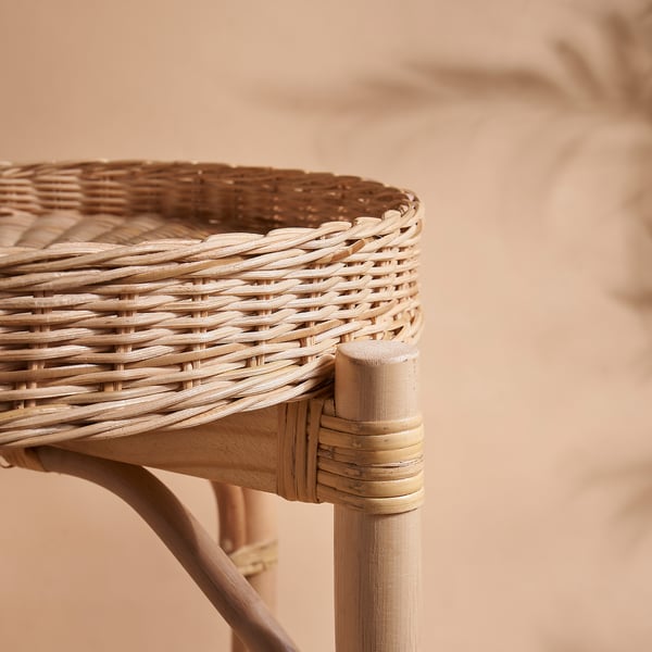 Handwoven rattan table detail, showcasing intricate design and natural texture.