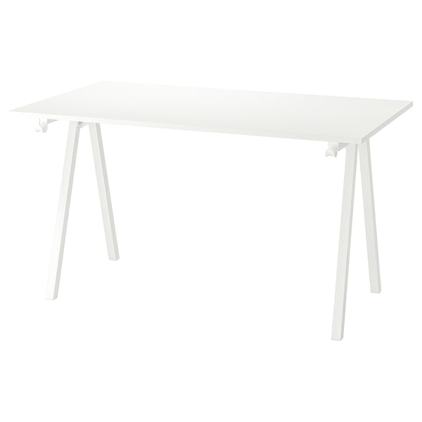 A white TROTTEN desk. Its rectangular, supported by angled white metal legs, and has a clean, minimalist design.