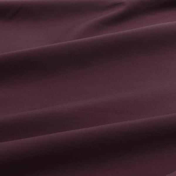 Close-up of smooth, crisp pillowcase showcasing tight weave, fine texture, and soft fabric quality.
