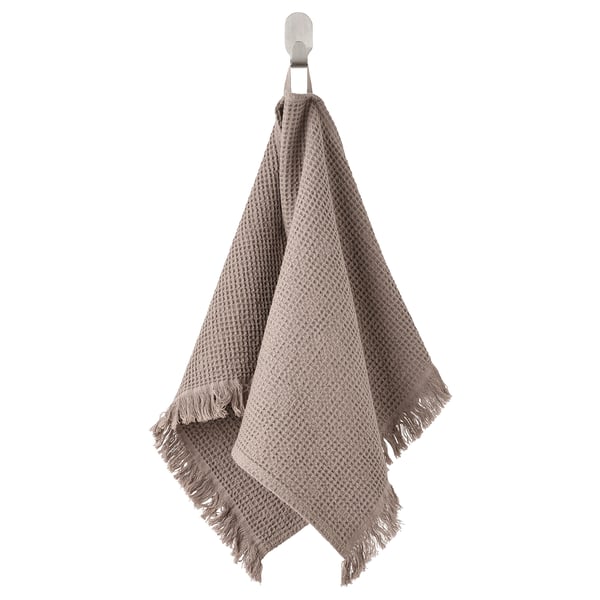 VALLASÅN towel: gray-brown, waffle weave, cotton/viscose, fringe edges, hangs on hook.
