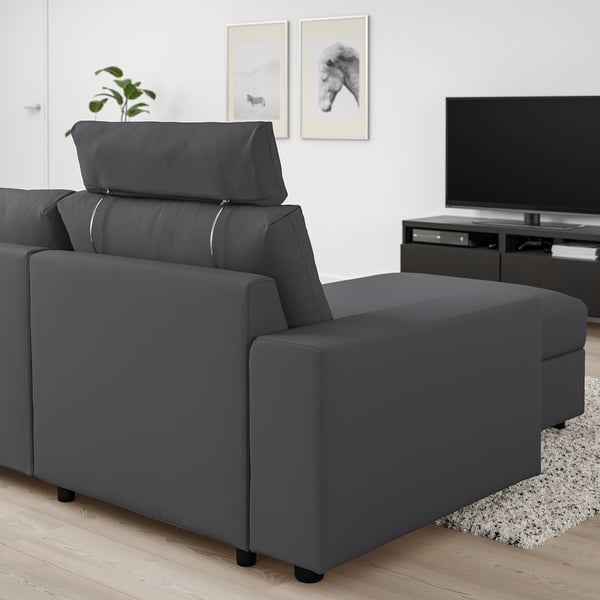 Modern dark grey VIMLE sectional sofa in living room. Adjustable headrest and chaise lounge.