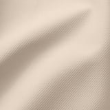 Soft, textured beige fabric in a two-tone weave, likely a cover for furniture, showcasing durability and comfort.