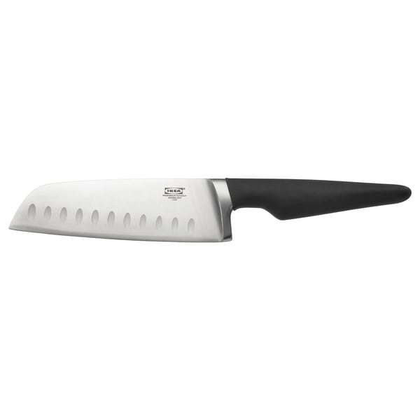 A VÖRDA vegetable knife with a black handle and silver blade, designed with indentations for easy slicing.