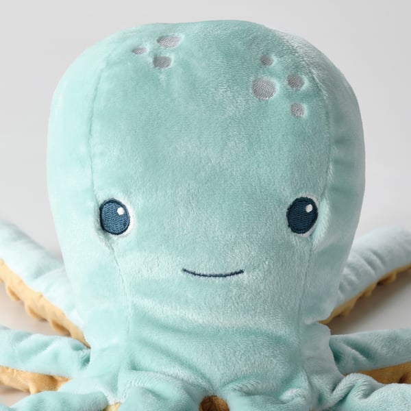 Soft plush octopus toy with big eyes, light blue with grey spots, high-quality materials.