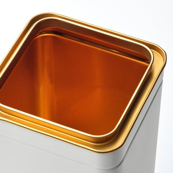 Gold-lined white container, high-quality tinplate steel, elegant design.