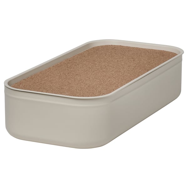 A HARVMATTA light beige metal storage box with a cork lid, rectangular in shape, ideal for organising desk accessories.