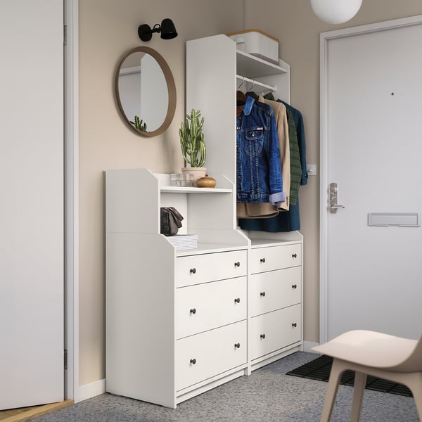 White HAUGA entryway furniture with drawers, shelves, mirror, plants.