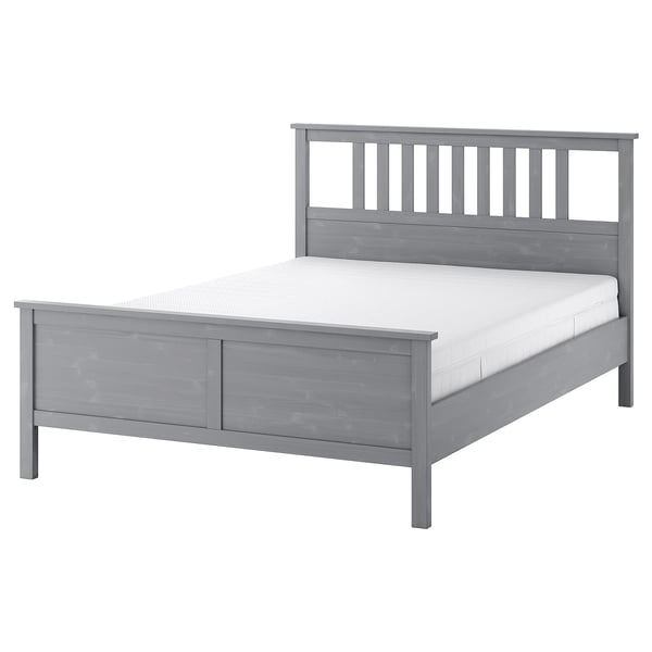 Grey HEMNES wooden bed with slatted headboard and footboard.