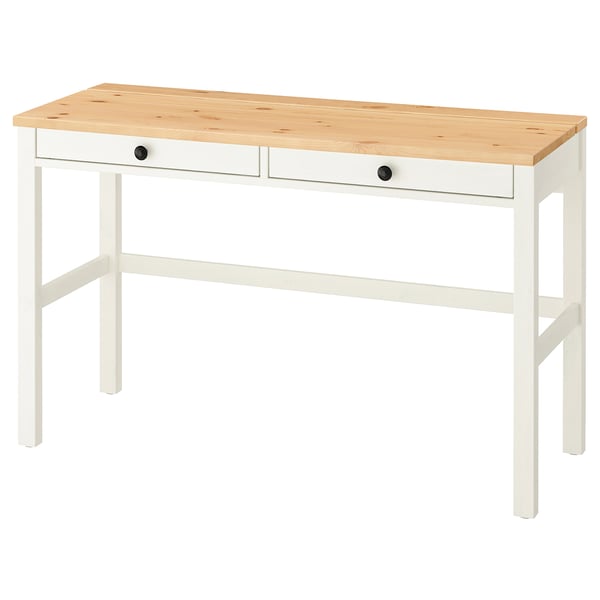 A white and light wood HEMNES desk with two drawers and sturdy legs.