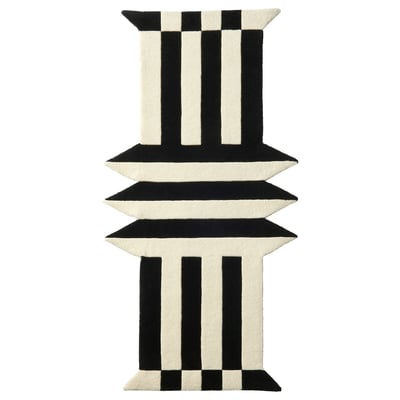 Black and white striped rug, rectangular, made of wool and plastic.