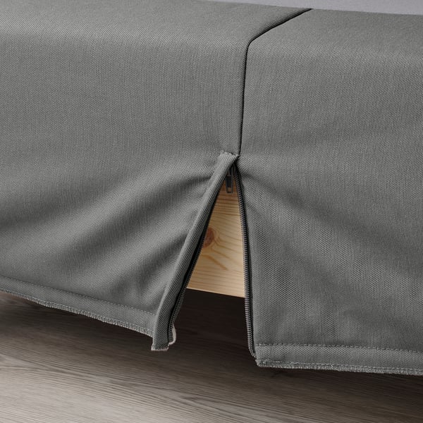 A removable cover for a flat-pack bed base, highlighting its easy cleaning feature.