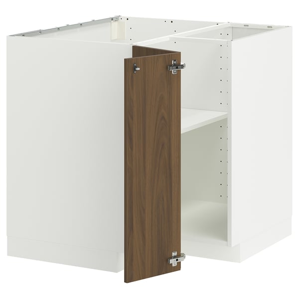 Modern white kitchen cabinet with walnut door, metal hinges.