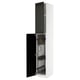 A white METOD kitchen cabinet with black bodbyn bevelled doors, open to reveal organised storage compartments.