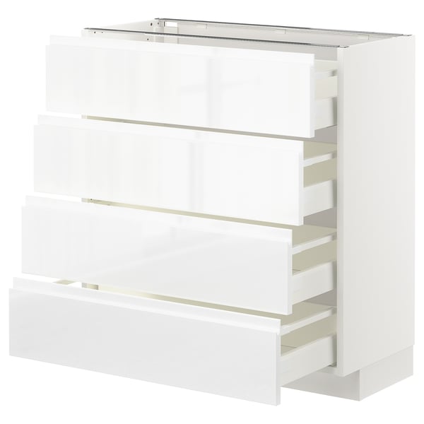 White high gloss kitchen cabinet with pull-out drawers.