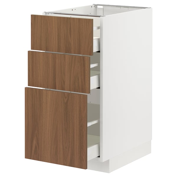 Modern white METOD kitchen unit with three wooden drawers, sleek design.