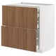 White ikea METOD unit with walnut drawers, sleek wood grain design.