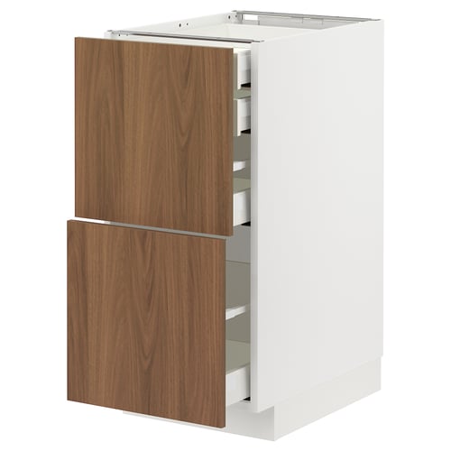 Modern white METOD kitchen cabinet with wooden drawers.